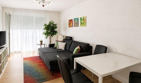 Well-maintained 2-room apartment with a southwest-facing terrace, a separate entrance, and a parking space in an underground garage.