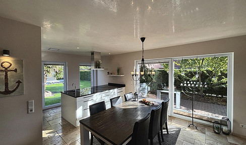 Two residential buildings with a pool, solar panels, and battery storage – available without commission.