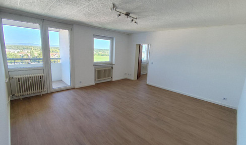 Well-maintained, partially renovated 2-room apartment with a balcony and kitchen area for rent.