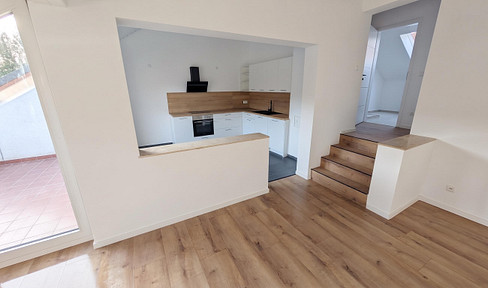 First occupancy after renovation: 2-room apartment with balcony, underground parking space, and fitted kitchen.
