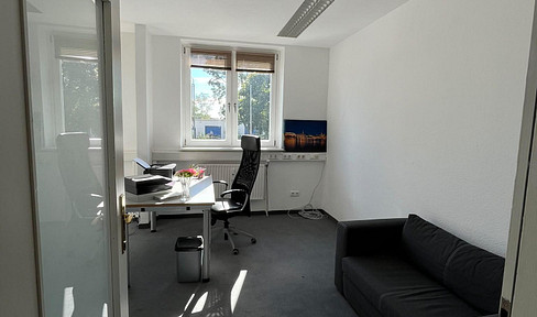 Office space for rent in a shared office environment.