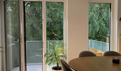 Langenbach I: Modern 3-room apartment with kitchen island and solar panel system.