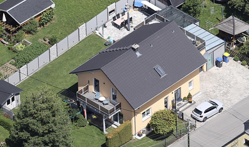 Modern detached house with geothermal heating, a conservatory, and spacious terraces.