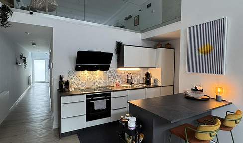 Bright, open-plan 3.5-room apartment spread over three levels.