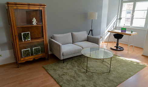 Furnished, stylish 2-room apartment with a balcony overlooking greenery.