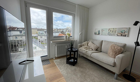 Stylish 2-room apartment with a sun balcony, offering views over the rooftops of Norderney.