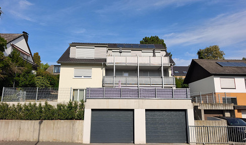 Renovated ground-floor apartment with 4 rooms, a large balcony, and a garden area.