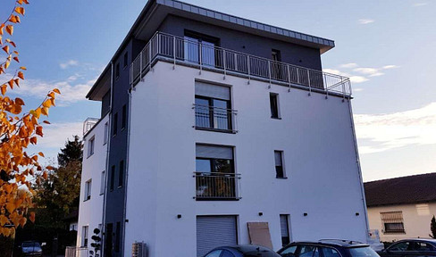 One-bedroom apartment with a fitted kitchen and a large south-facing balcony.