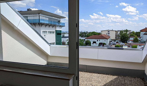 Bright attic apartment with a rooftop terrace and a parking space in an underground garage.