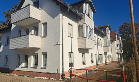2-room apartment with a spacious living/kitchen area, balcony, and parking space in Müggelheim.