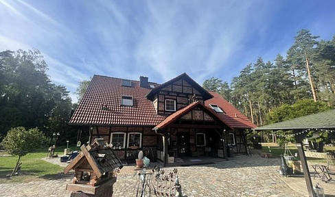 Charming property in a secluded, park-like setting – a half-timbered two-family house north of Berlin.