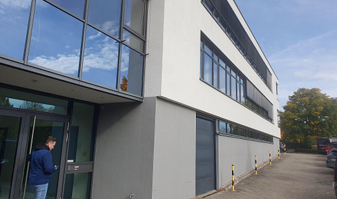 Modern exhibition and storage space with an additional sectional door.