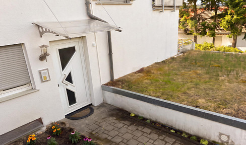 2-room apartment with balcony, garage attached to the building, charging station for electric vehicles, heat pump, solar panels, and available quickly in Bad Homburg.