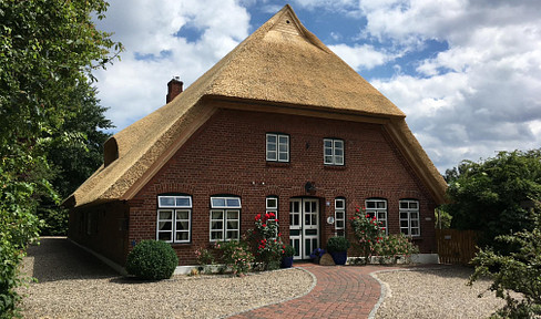 Representative thatched farmhouse with beautiful garden