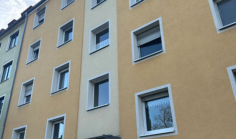 Central, one-bedroom apartment with a kitchenette.