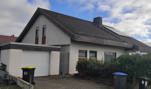 Detached house with an open gallery and fireplace.