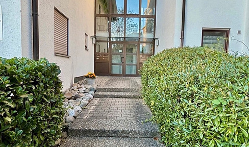 Centrally located 2-room apartment with balcony and underground parking.