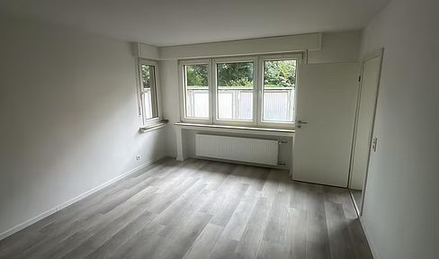 Kernsanierte 2-Zimmer-Erdgeschosswohnung mit Gartennutzung & optionaler Garage