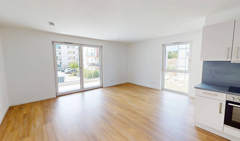 Modern living comfort: Bright, newly built 3-room apartment with a balcony and fitted kitchen.