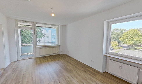 Modern 3-room apartment with a balcony and fitted kitchen, located within walking distance of the Eider River.