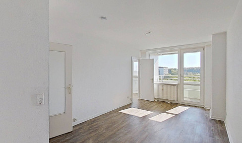 Comfortable living for singles: Modern one-bedroom apartment with fitted kitchen and balcony.