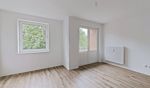 Spacious studio apartment with a balcony.