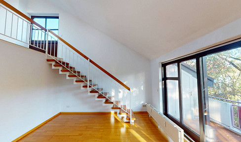 Beautiful 2-room apartment with a mezzanine level, balcony, and plenty of natural light.