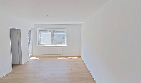 Renovated 1-bedroom apartment with balcony, fitted kitchen, and modern shower room.