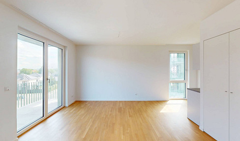Modern 2-room apartment with fitted kitchen and balcony, located in a new development area.