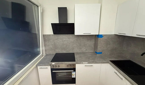 Renovated 2-room apartment with a new fitted kitchen and a garage.