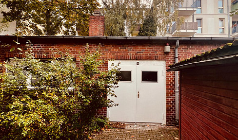 Charming brick cottage in a green setting: perfect for working and living.