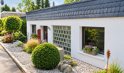 A detached or semi-detached house in a quiet, elevated location in Ennepetal, offering unobstructed views of the surrounding landscape.