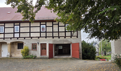 Living on a traditional farmhouse with buildings on all four sides.