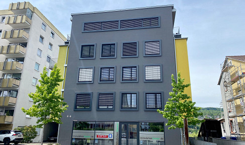 Modern 3-room apartment with a balcony, fitted kitchen, and underground parking space.